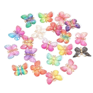 Macro shot of colorful acrylic butterfly charms with honeycomb texture for DIY jewelry making