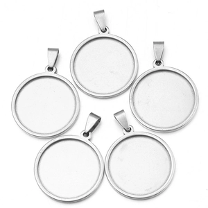 Detailed view of 5 round stainless steel pendant trays for DIY jewelry making