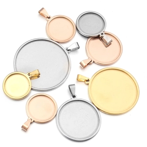 Detailed view of various round stainless steel pendant trays in gold and silver finishes