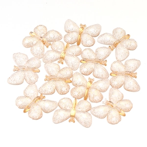 DIY colorful acrylic butterfly charms with white honeycomb patterns and gold accents
