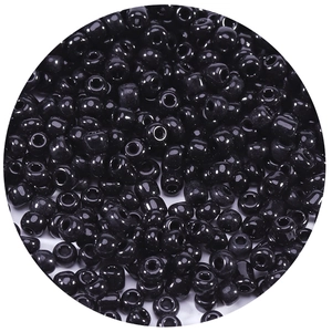 Macro shot of glossy black round glass seed beads for DIY jewelry and crafts