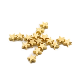 Macro view of golden star-shaped CCB beads for DIY jewelry and accessory making
