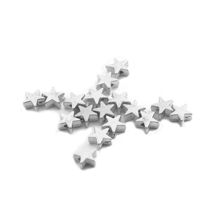 Close-up of shiny silver CCB star beads with perforated holes for DIY jewelry making