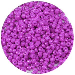 Macro shot of 1000 purple glass seed beads showing hole detail and smooth round finish