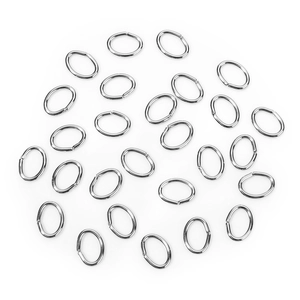 Macro shot of silver oval open jump rings for DIY jewelry making on white background