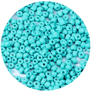 Macro shot of turquoise glass seed beads for DIY jewelry making and beadwork crafts
