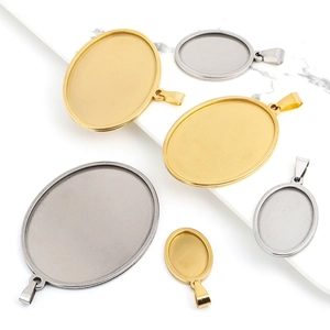 Dettaglio di basi per ciondoli ovali in acciaio inossidabile oro e argento per gioielli DIY