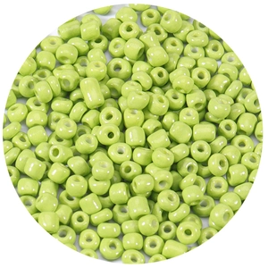 Macro shot of 2.5-4mm grass green glass seed beads for DIY jewelry and crafts
