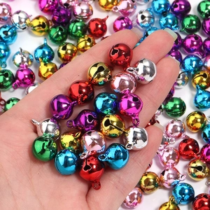 Colorful festive metal bells set in various glossy shades for DIY crafts and decorations