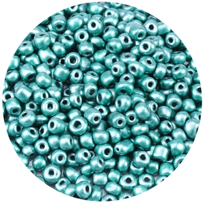 Macro shot of 1000 pack metallic teal glass seed beads for DIY jewelry and crafts