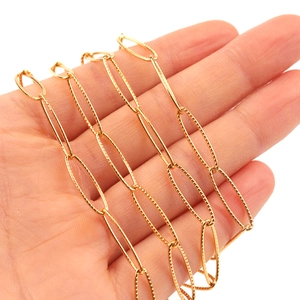 Detail of 18k gold plated stainless steel flattened O-chain with textured oval links