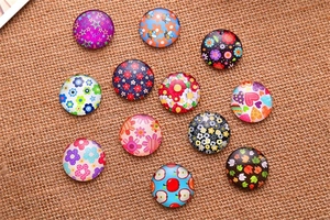Detailed view of colorful Tree of Life glass cabochons on natural rustic burlap surface