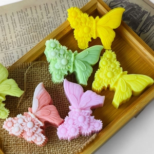 3D butterfly and flower silicone molds for handmade candles in colorful macaron shades