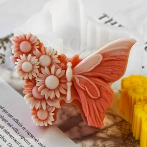 Detail of butterfly silicone mold for handmade soap with embossed daisy flower patterns