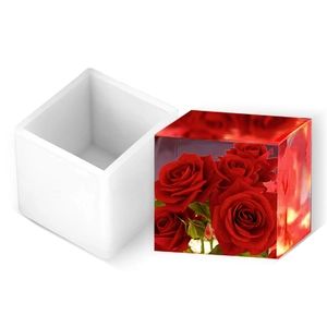 Square silicone mold for DIY resin cubes with a finished clear rose flower ornament