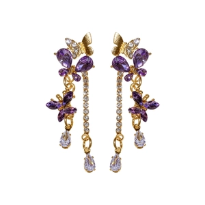 Orecchini vintage a farfalla in oro con cristalli viola e nappe di strass lunghi