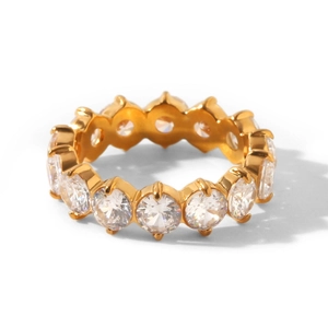 Macro view of gold plated eternity ring with round cut cubic zirconia stones