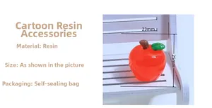 Macro shot of 23mm x 25mm red resin apple miniature with green leaf for DIY crafts