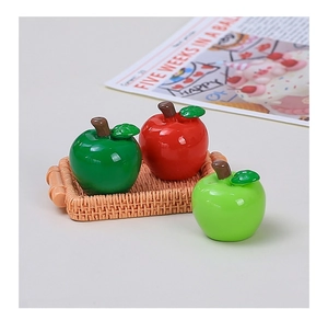 Detailed view of mini 3D resin apples in a woven basket for DIY creative crafts