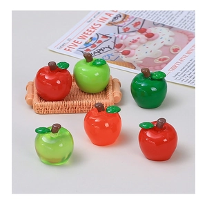 Detailed view of glossy miniature resin apples for creative DIY handmade jewelry accessories
