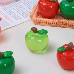 Miniature red resin apples in a woven basket for DIY crafts and home decor