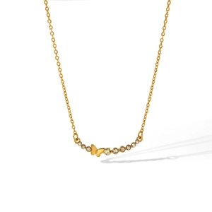 Detailed macro view of gold-plated stainless steel butterfly pendant with crystal accents.