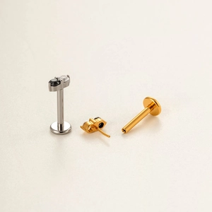 Set of G23 titanium push-in labret studs with black and clear stones for piercing