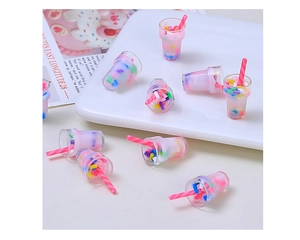 Macro shot of colorful resin bubble tea miniatures with striped straws for DIY crafts