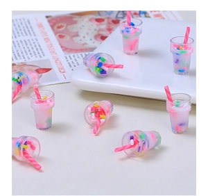 Miniature pink bubble tea resin charms with straw and colorful sprinkles for DIY crafts