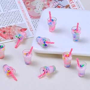Miniature pink bubble tea resin charms with colorful sprinkles for DIY crafts and decor