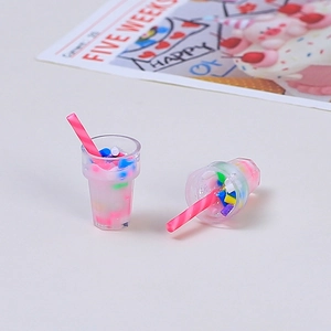Miniature pink bubble tea resin charms with colorful sprinkles for DIY crafts and accessories