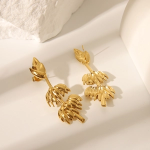 Detailed view of gold plated stainless steel earrings with unique banana bunch design