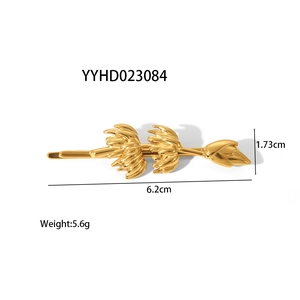 Detail view of a gold-plated stainless steel banana design hair clip with specific dimensions