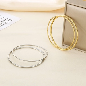 Minimalist 18K gold-plated 2mm thin wire layered bangles in gold and silver finish