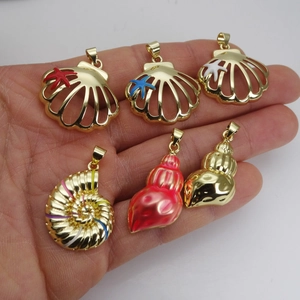 Detailed close-up of zircon-inlaid seashell pendants in multiple marine designs