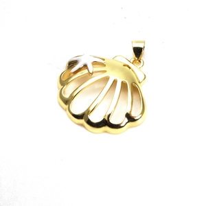 Macro detail of gold plated scallop shell pendant with white starfish and cubic zirconia