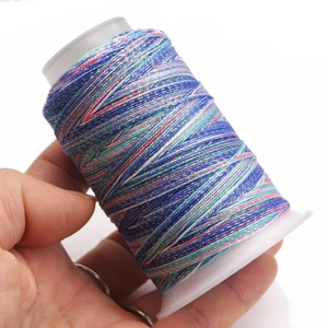 Macro shot of 6-strand gradient wax thread on spool for DIY jewelry and bracelet weaving