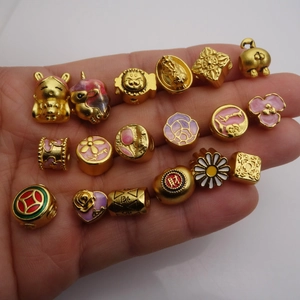 Golden Feng Shui lucky charms with colorful enamel details and traditional Chinese motifs