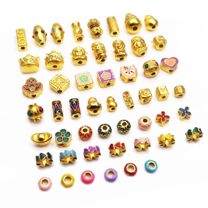 Gold-plated copper bead set featuring traditional heart and animal motifs for DIY jewelry