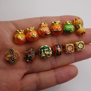 Gold-plated enamel charms featuring lucky pouches and traditional Chinese motifs for jewelry