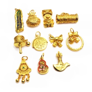 Set of 11 gold plated DIY jewelry charms including fortune bags and enamel lily flowers