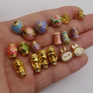 Gold-plated enamel flower beads and butterfly charms for DIY jewelry making