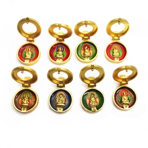 Golden zodiac protector pendants set with colorful enamel deity carvings in circular design