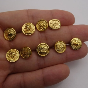 Set of 9 vintage gold-plated metal buttons with character reliefs and intricate engravings