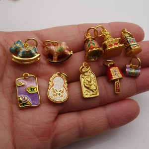 Set of 9 gold-plated enamel charms featuring traditional Chinese motifs like pagoda and fish