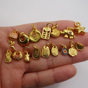 Collection of matte gold charms featuring rose, abacus, and elephant for DIY jewelry making