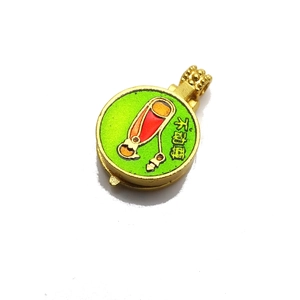Detailed view of golden zodiac pendant with green enamel and Buddhist Fudo Myoo motif
