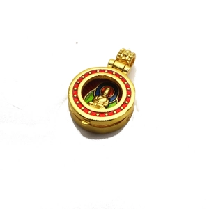 Detail of gold Buddha pendant with colorful enamel work and ornate engraved bail