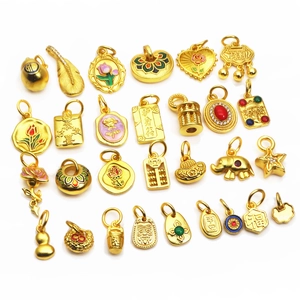Collection of gold-plated lucky charms featuring traditional Chinese enamel motifs and symbols