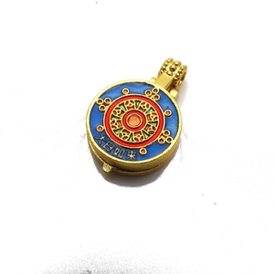 Detailed macro view of gold-plated mandala pendant featuring colorful enamel artwork